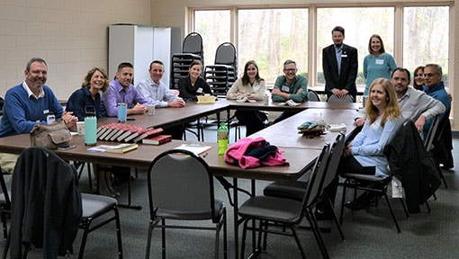 Gathering of adults in a classroom