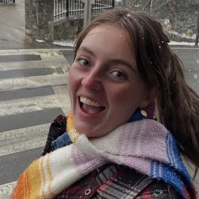 Youth intern Nick Billman wearing white dress shirt and yellow tie