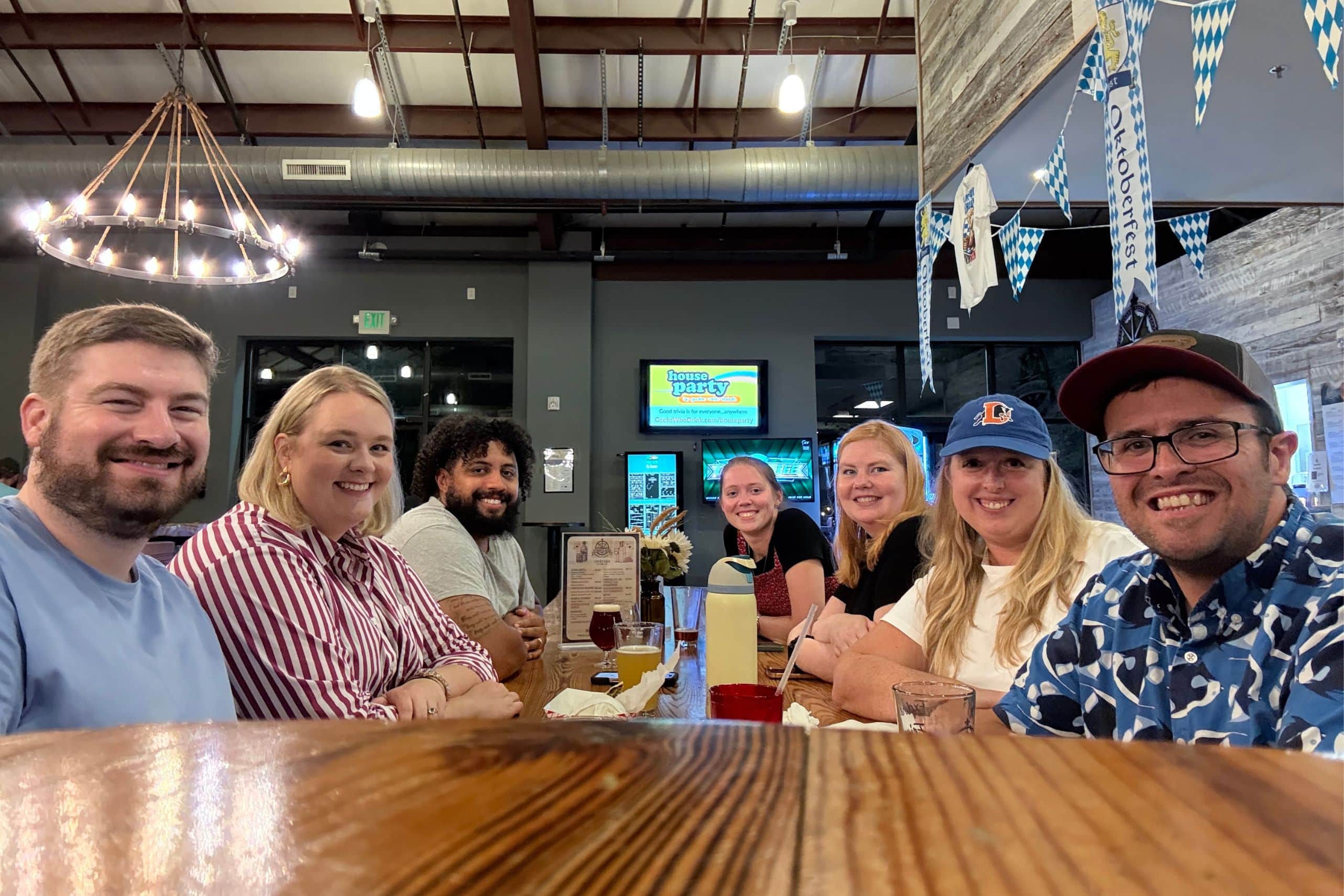 Group of adults sitting around round tables