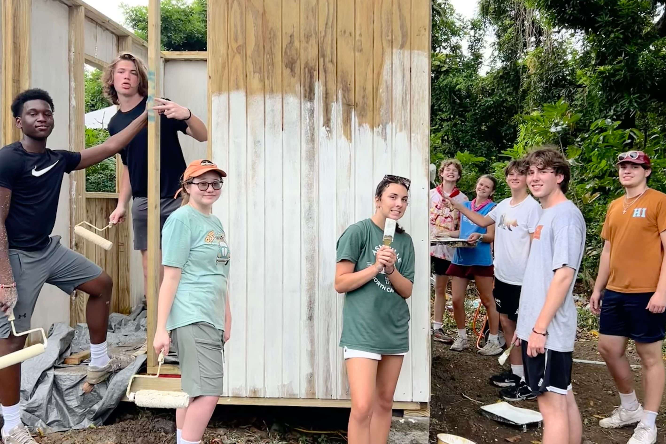 Four middle school boys pose for camera at a summer camp